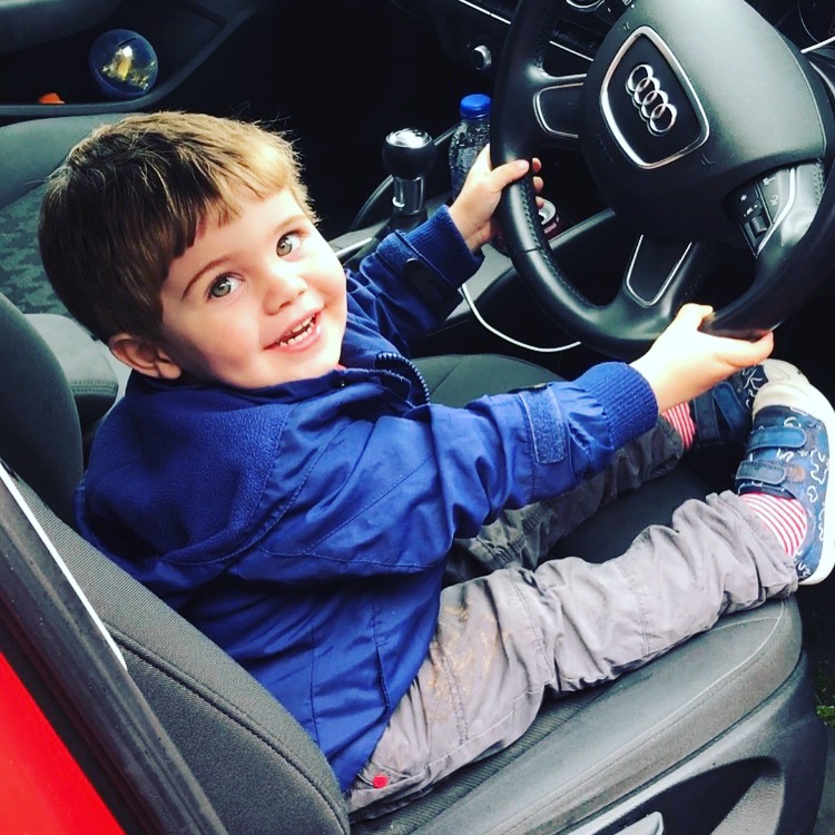 toddler pretending to drive